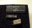 SP0256-017 Voice Chip And It's Rom SPR016-117 3.12 Mhz Xtal. Fixed Price $42.00.