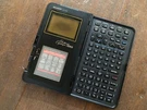 Vintage Electronic Organizer Sharp Iq 7200. Fixed Price $65.00.