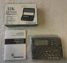 Vintage (1997) Radio Shack 65-744 12K Memory Electronic Organizer W Box & Book. Fixed Price $22.00.
