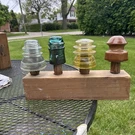 Lot Of 4 Clear, Blue, Brown Glass Electric Pole Insulators With Stand. Fixed Price $99.99.