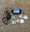 Sony PSP-1001 Black Console Bundle Includes Battery/charger & 6 Discs Tested. Fixed Price $100.00.