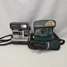 Lot Of 2 Polaroid Cameras Sun 600 Lms & Green Onestep Express W/ Bag Untested. Fixed Price $38.95.