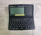 Sharp Wizard OZ-630 Black 256 Kb Personal Information Organizer *powers On*. Fixed Price $19.95.