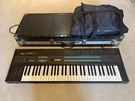 Yamaha DX-7 Digital Synthesizer Keyboard Comes With Carrying Case And Sleeve. Fixed Price $499.00.