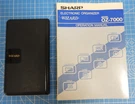 Sharp Wizard OZ-7000 Vintage Calculator/organizer With Original Manual. Fixed Price $8.99.